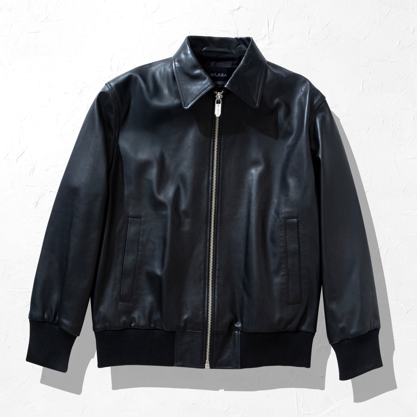 Black Collared Bomber leather jacket on a white background