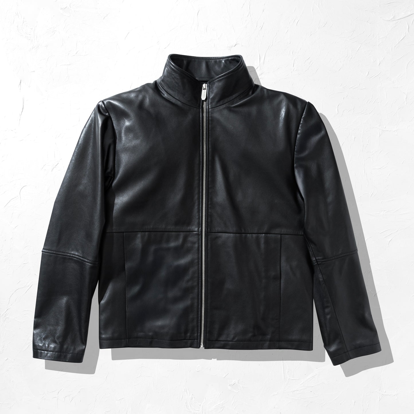 Black leather jacket on a white background