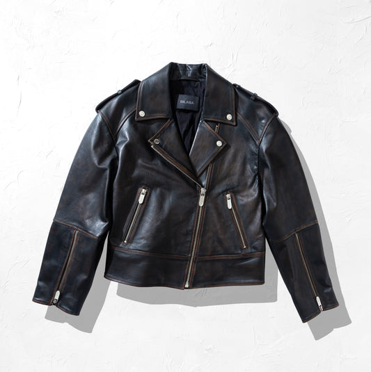 Black vintage leather biker jacket with zippers on a white background